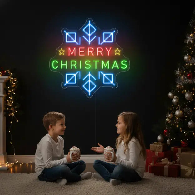 Photo of the 'Merry Christmas in a Snowflake' neon sign glowing in Multicolor against a styled interior wall.