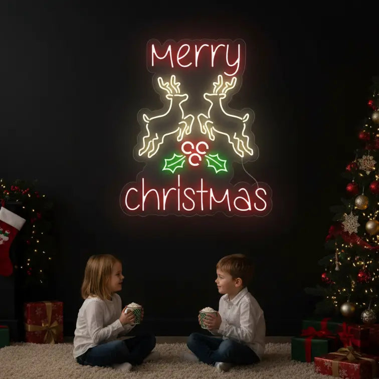 Photo of the 'Merry Christmas Reindeer' neon sign glowing against a styled interior wall.