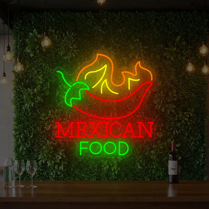 Photo of the 'MEXICAN FOOD' neon sign glowing in multi-color against a styled interior wall.
