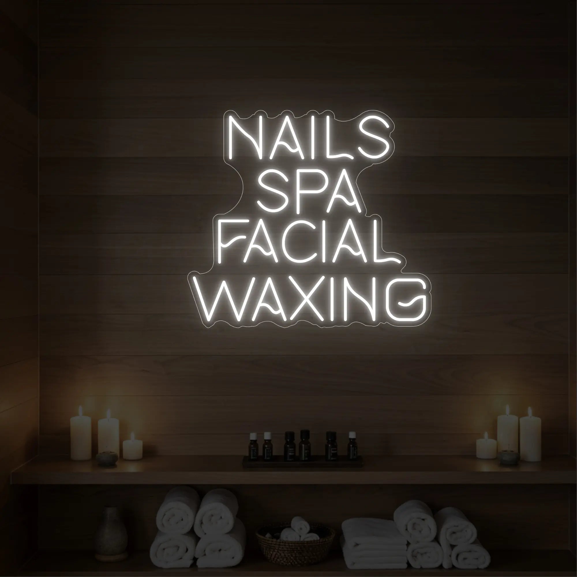 Photo of the 'Nails Spa Facial Waxing' neon sign glowing in cool white against a styled interior wall.