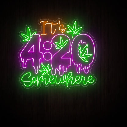 It's 4:20 Somewhere LED neon sign featuring dripping purple 4:20 numbers, green cannabis leaves, and glowing script lettering on a clear acrylic backboard.