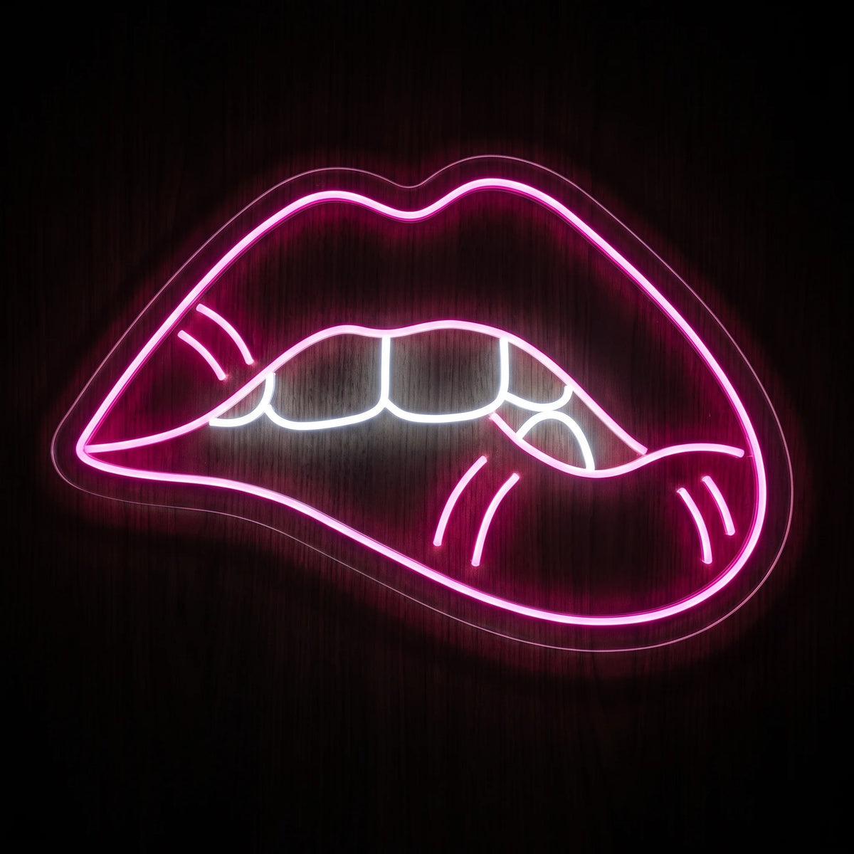 Neon Lips LED neon sign with vibrant pink lips and white teeth illumination on clear acrylic backing.