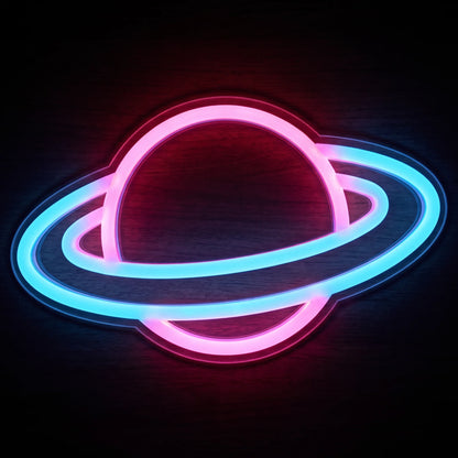 Neon ringed planet LED neon sign with vibrant pink and blue illumination on clear acrylic backing.