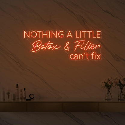 Photo of the 'Nothing a Little Botox & Filler Can’t Fix' neon sign glowing in golden yellow against a styled interior wall.