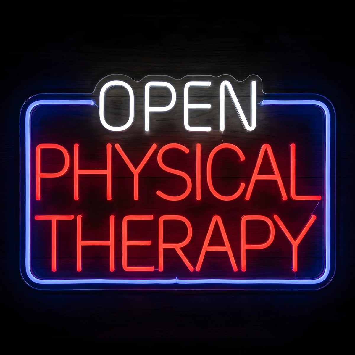 Open Physical Therapy Clinic LED Neon Sign with white OPEN lettering, red PHYSICAL THERAPY text, and a glowing blue rectangular border on clear acrylic against a dark wooden wall.