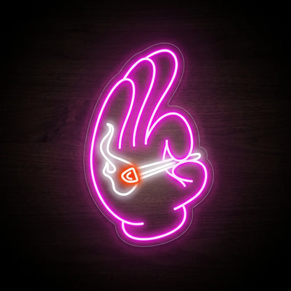 Pink peace hand gesture holding a lit joint LED neon sign mounted on a precision-cut clear acrylic backing.