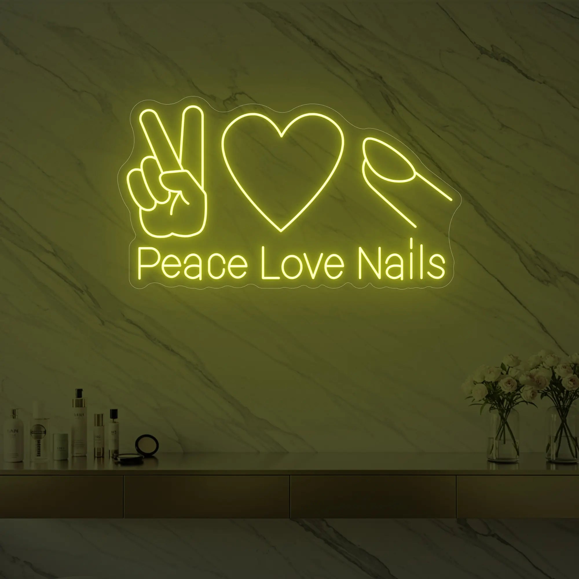 Photo of the 'Peace Love Nails' neon sign glowing in lemon yellow against a styled interior wall.