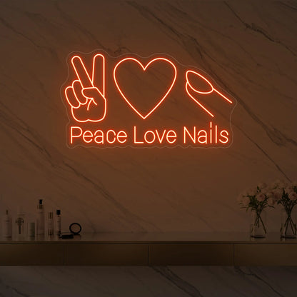 Photo of the 'Peace Love Nails' neon sign glowing in golden yellow against a styled interior wall.