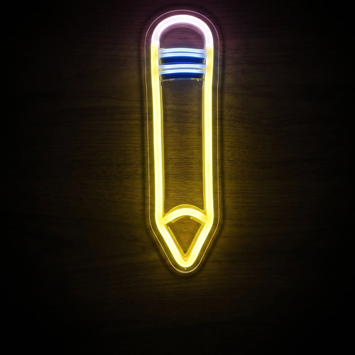 Pencil LED Neon Sign featuring a vertical pencil design illuminated in yellow, white and blue LED neon on clear acrylic backing.