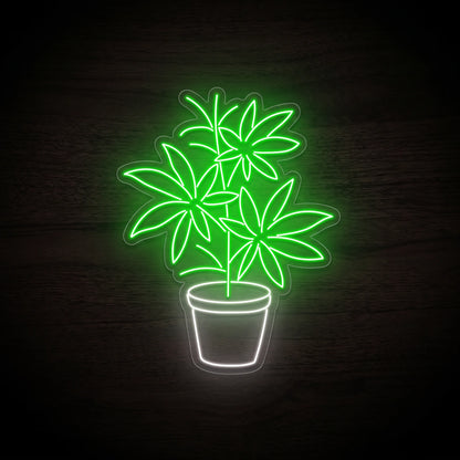Green potted cannabis plant LED neon sign with a white planter mounted on a precision-cut clear acrylic backing.