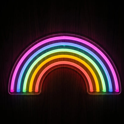 Rainbow arch LED neon sign with pink, blue, green, yellow-orange and red illumination on clear acrylic backing.