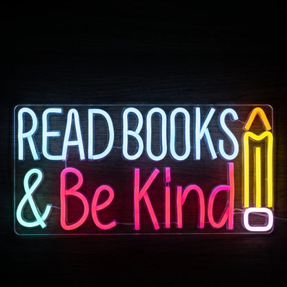 Read Books & Be Kind LED Neon Sign with colorful lettering and pencil design on clear acrylic backing.