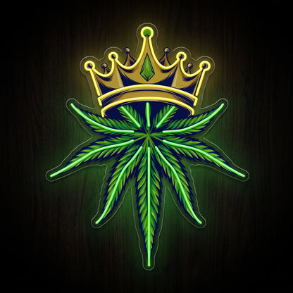 Royal Cannabis Crown LED neon sign featuring a gold crown above a vibrant green cannabis leaf mounted on a precision-cut clear acrylic backing.