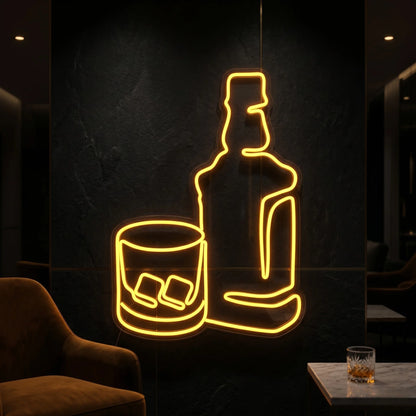 Photo of the 'Rum Bottle and Glass' neon sign glowing in yellow against a tropical bar-inspired wall.