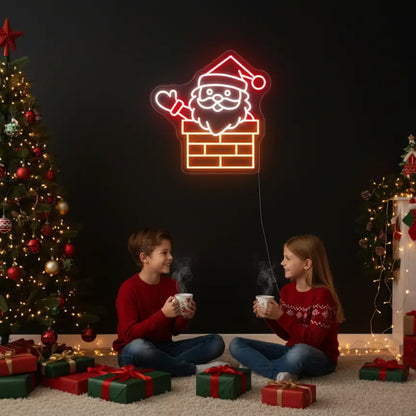 Photo of the 'Santa in Chimney' neon sign glowing in multicolor against a styled interior wall.