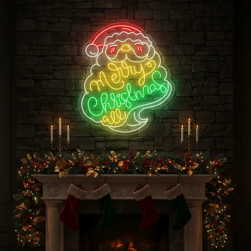 Photo of the 'Santa Merry Christmas' neon sign glowing in multicolor against a styled interior wall.