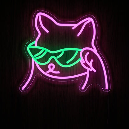 Shades Cat LED neon sign with pink cat outline and bright green sunglasses on clear acrylic backing.