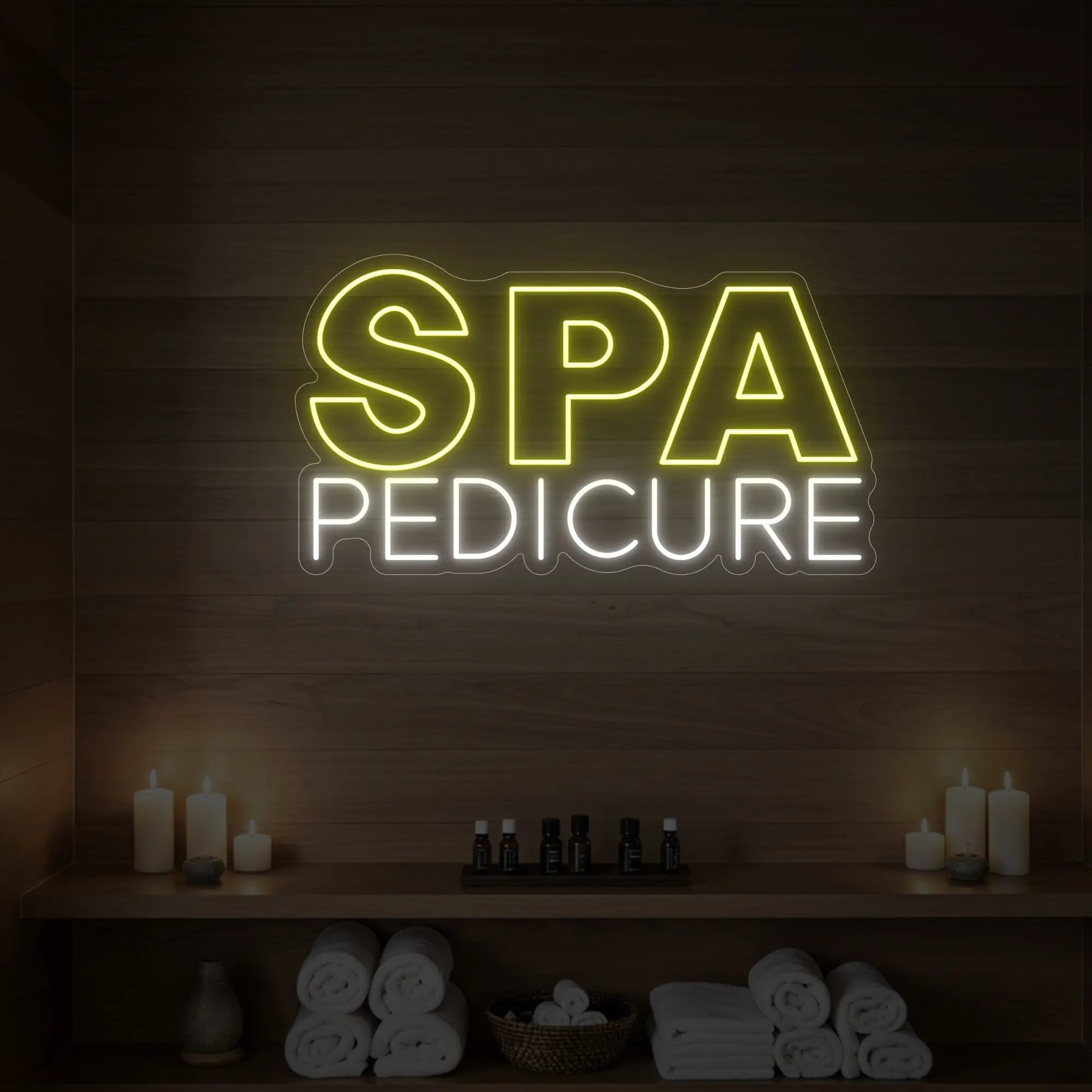 Photo of the 'Spa Pedicure' neon sign glowing in lemon yellow against a styled interior wall.