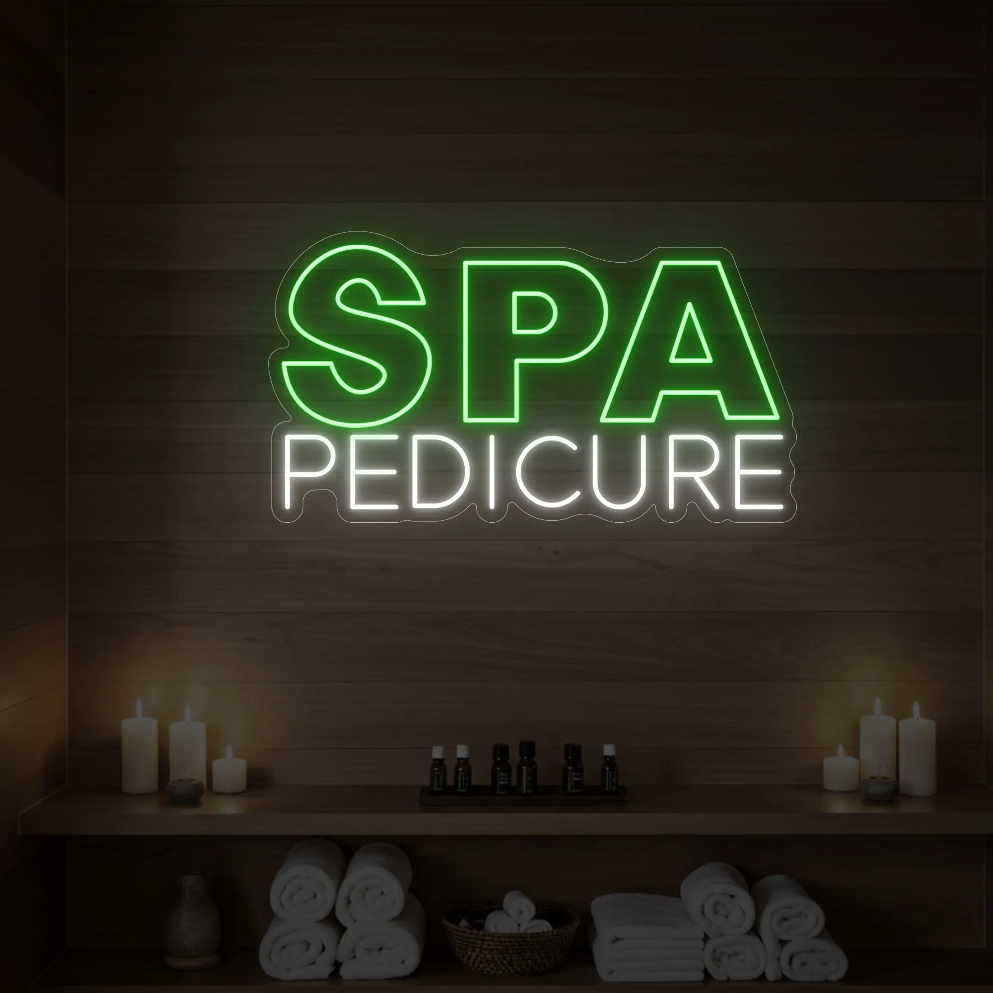 Photo of the 'Spa Pedicure' neon sign glowing in green against a styled interior wall.