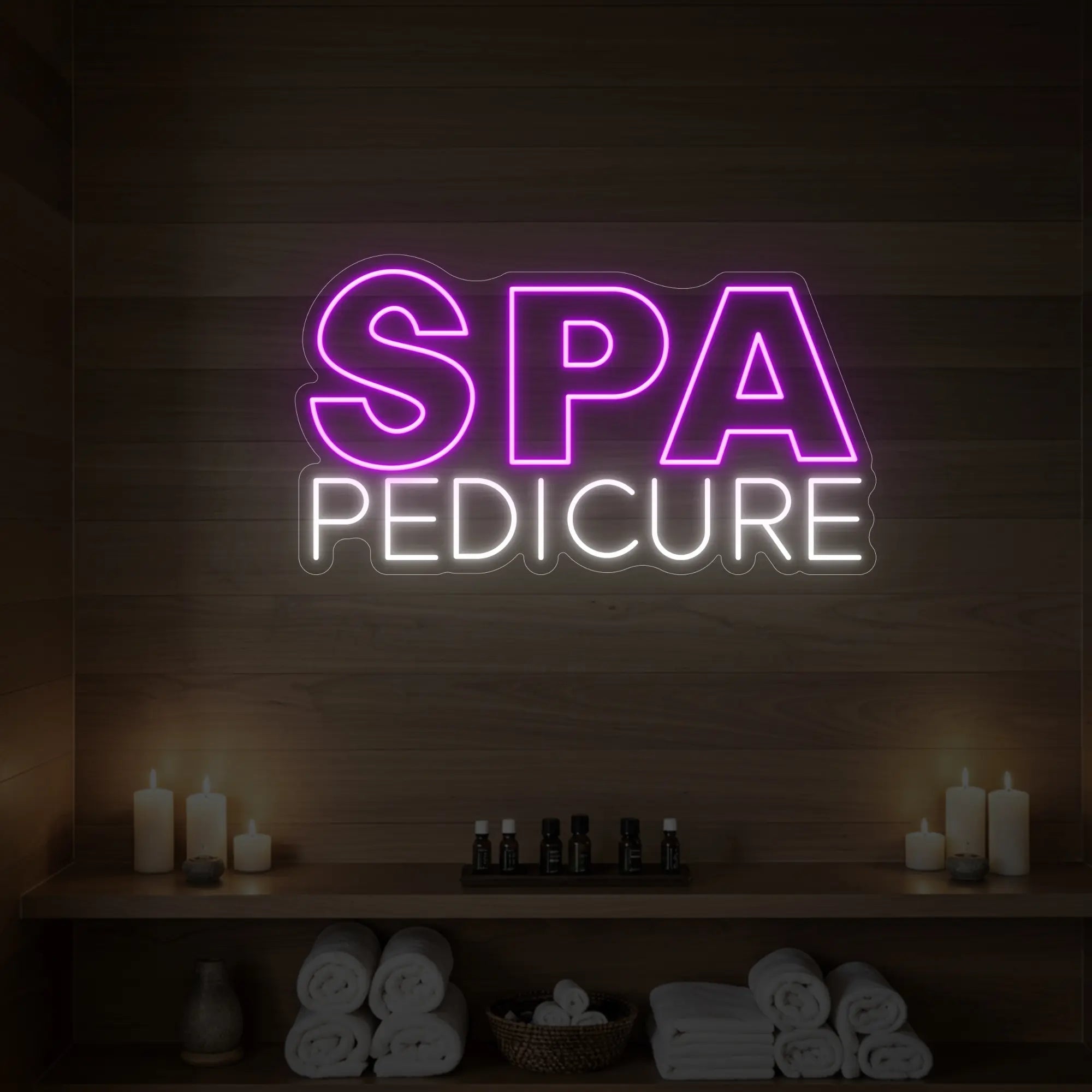 Photo of the 'Spa Pedicure' neon sign glowing in deep pink against a styled interior wall.