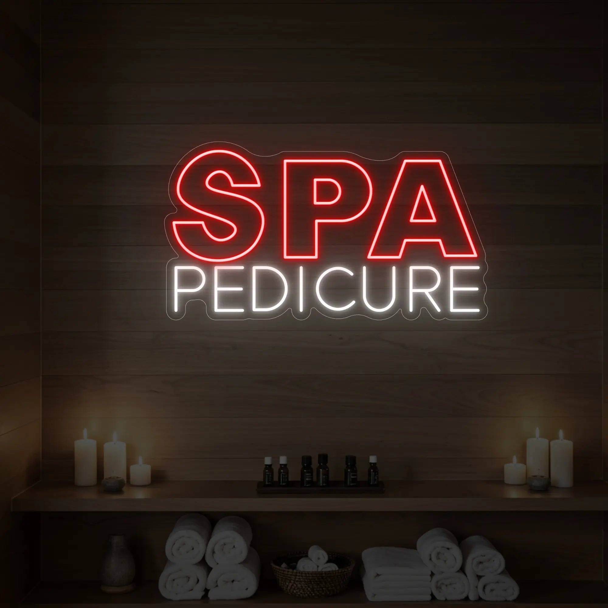 Photo of the 'Spa Pedicure' neon sign glowing in red against a styled interior wall.