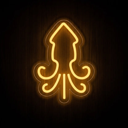 Squid Outline LED Neon Sign featuring a warm golden-yellow squid silhouette with curved tentacles on clear acrylic backing.