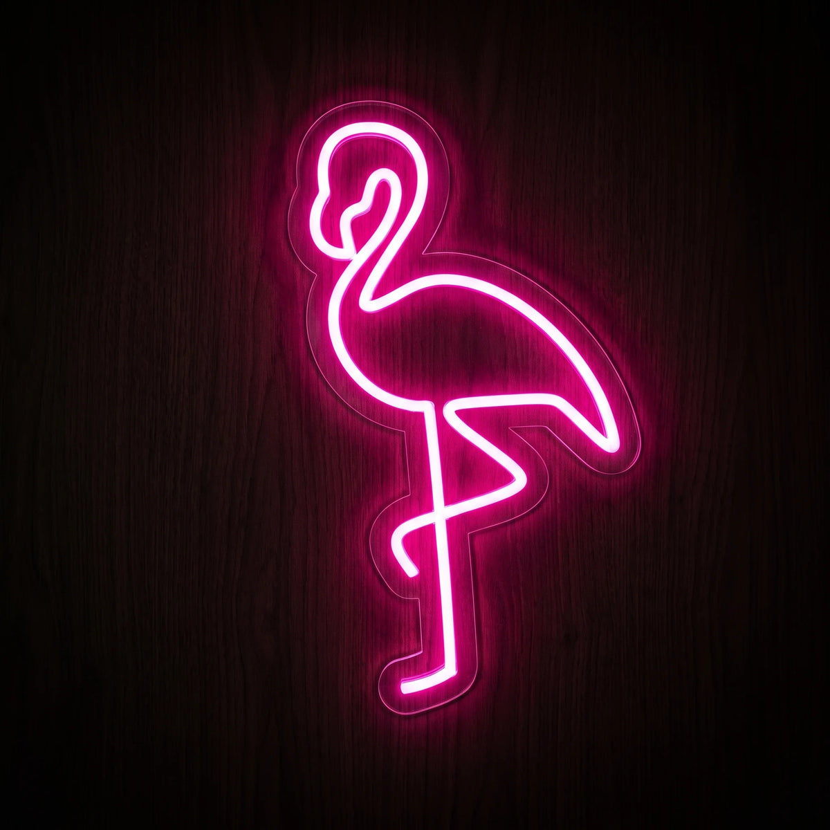 Standing Flamingo LED Neon Sign featuring a vibrant pink flamingo outline in a one-legged pose on clear acrylic backing.