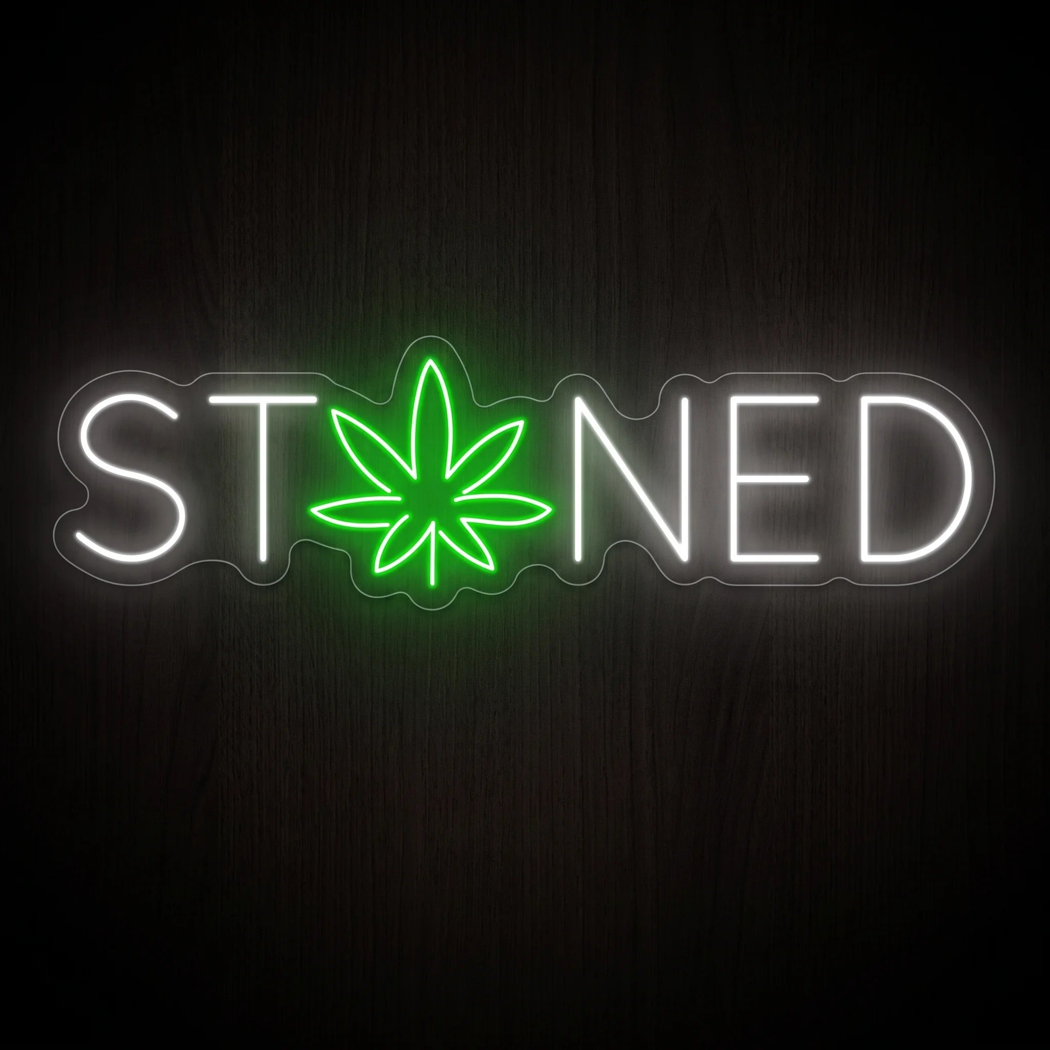Stoned LED neon sign featuring white lettering with a green cannabis leaf on a clear acrylic backing.