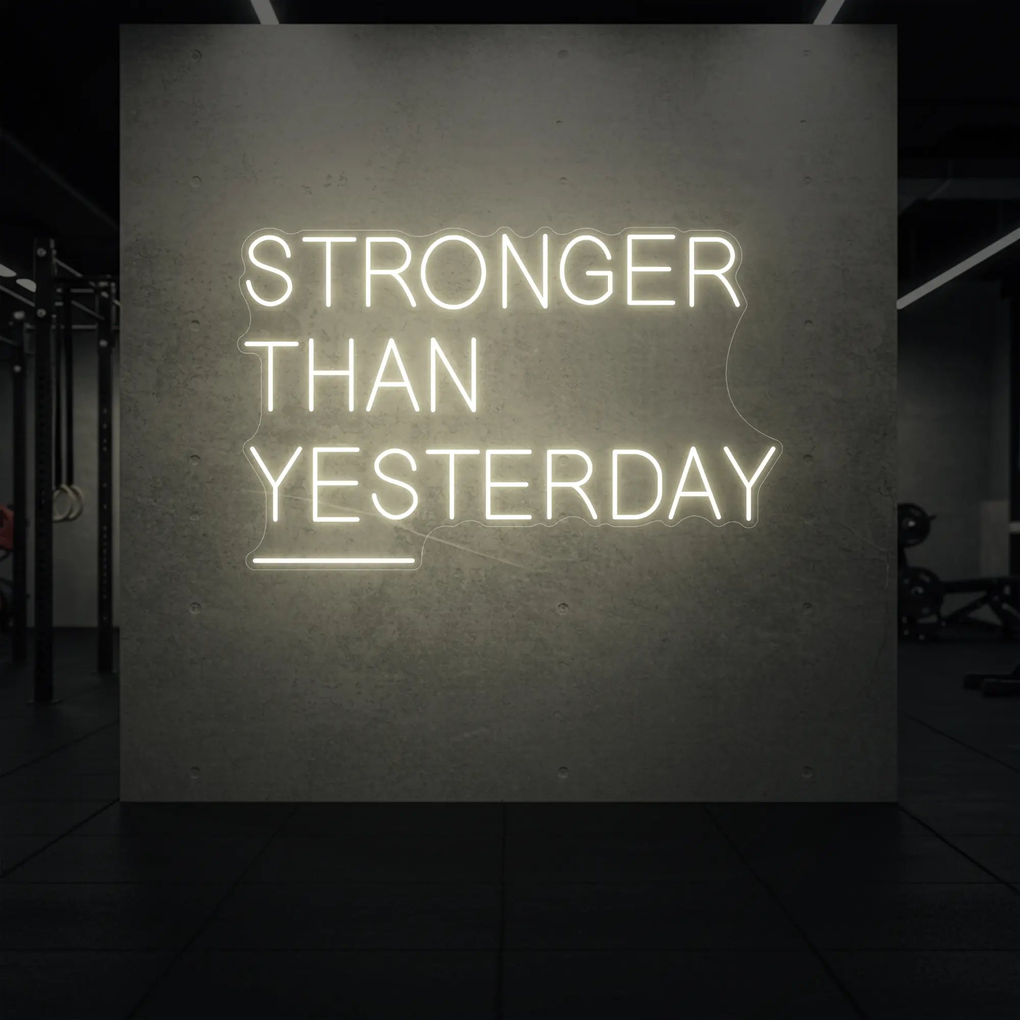  'Stronger Than Yesterday' neon sign glowing in warm white against a styled interior wall.