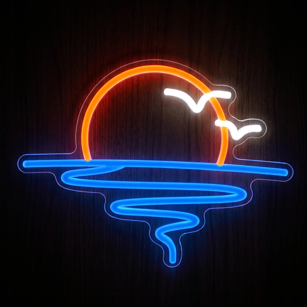 Sunset Island LED neon sign with orange-red setting sun, blue water reflection and two white flying birds.