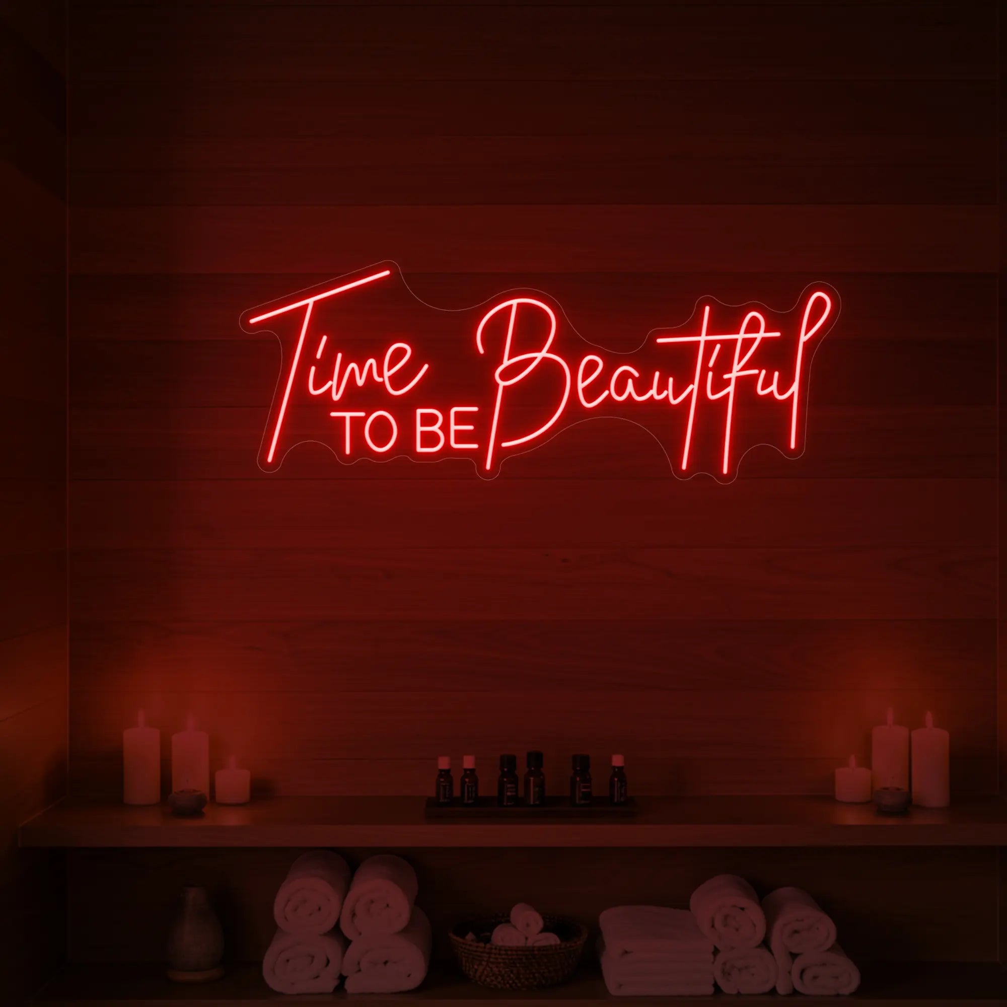 Photo of the 'TIME TO BE BEAUTIFUL' neon sign glowing in red against a styled interior wall.