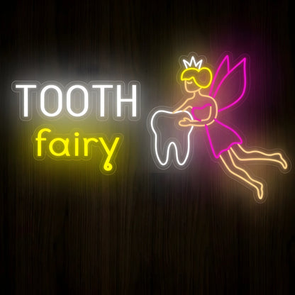 Tooth Fairy LED neon sign featuring white TOOTH and yellow fairy lettering beside a flying fairy with pink wings holding a glowing tooth on clear acrylic backing for pediatric dental clinic decor.