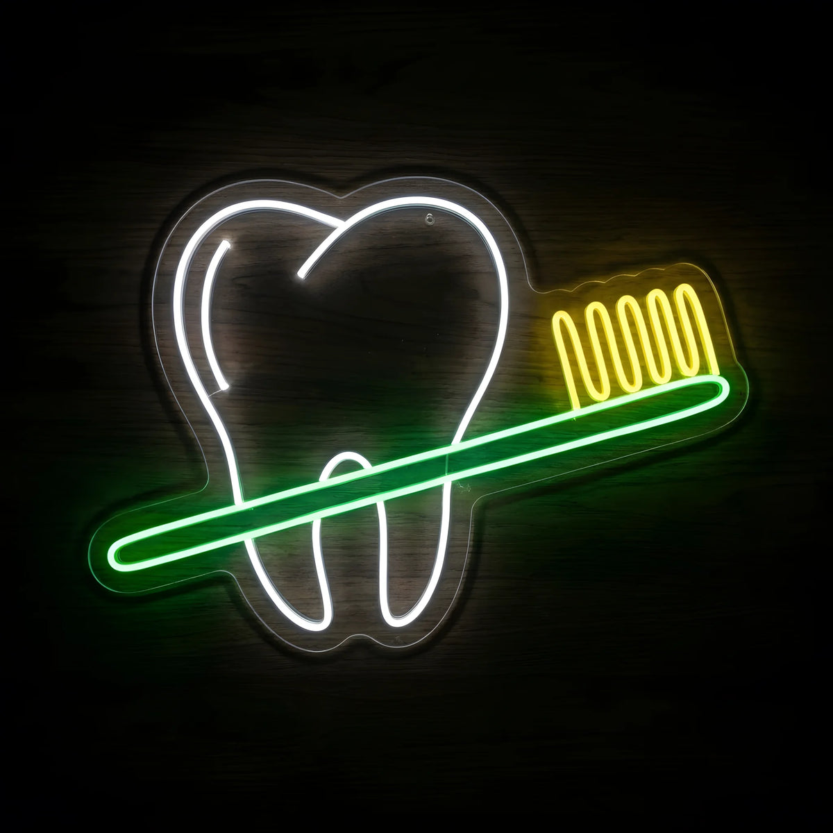 Toothbrush Dental Care LED neon sign featuring a cool white tooth outline crossed by a green toothbrush with yellow bristles on clear acrylic backing for dental clinic wall decor.