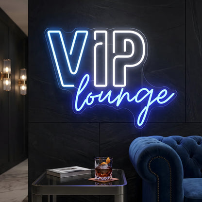 Photo of the 'VIP Lounge' neon sign glowing in multi-color against a luxury lounge-inspired wall.