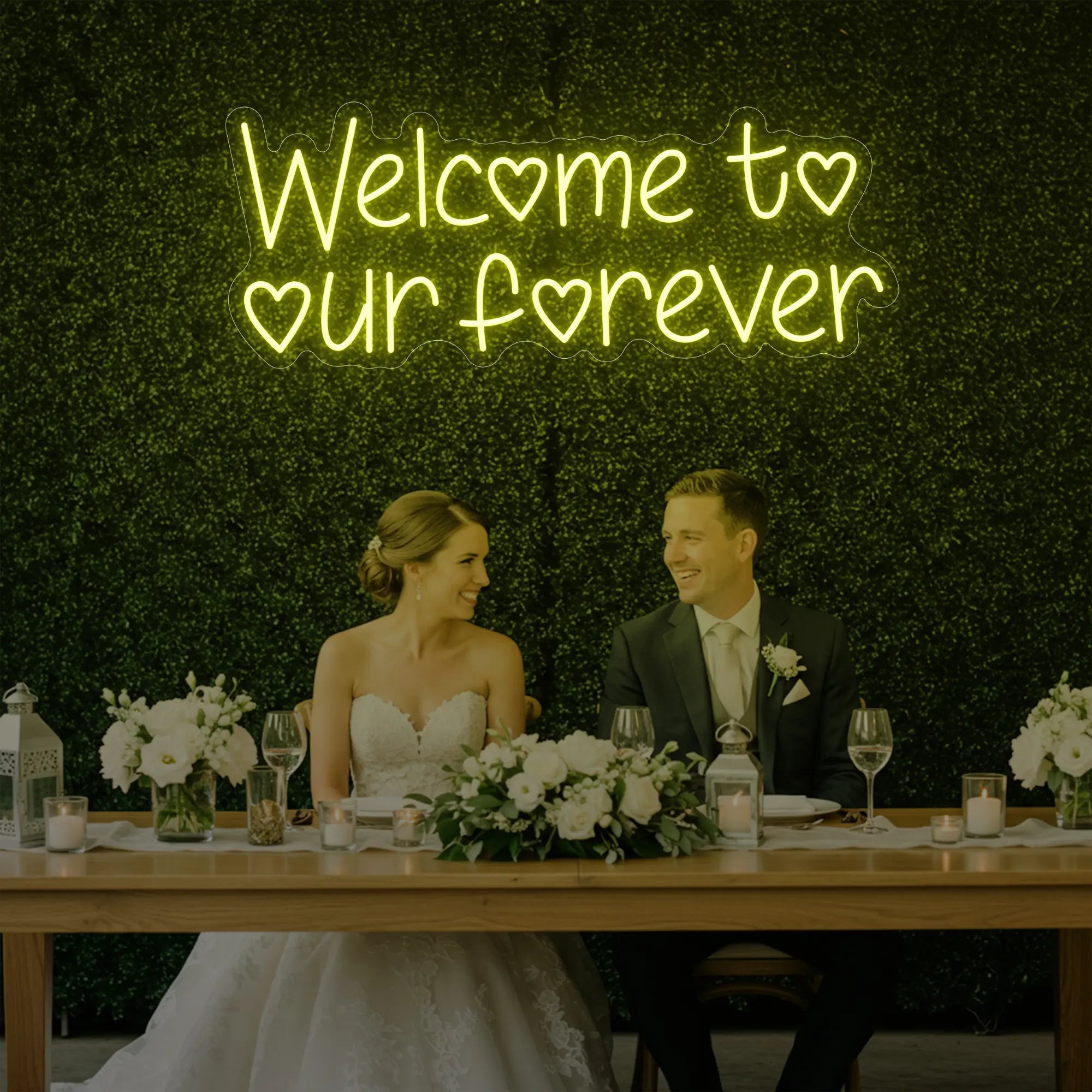  'Welcome To Our Forever' neon sign glowing in lemon yellow against a styled interior wall.