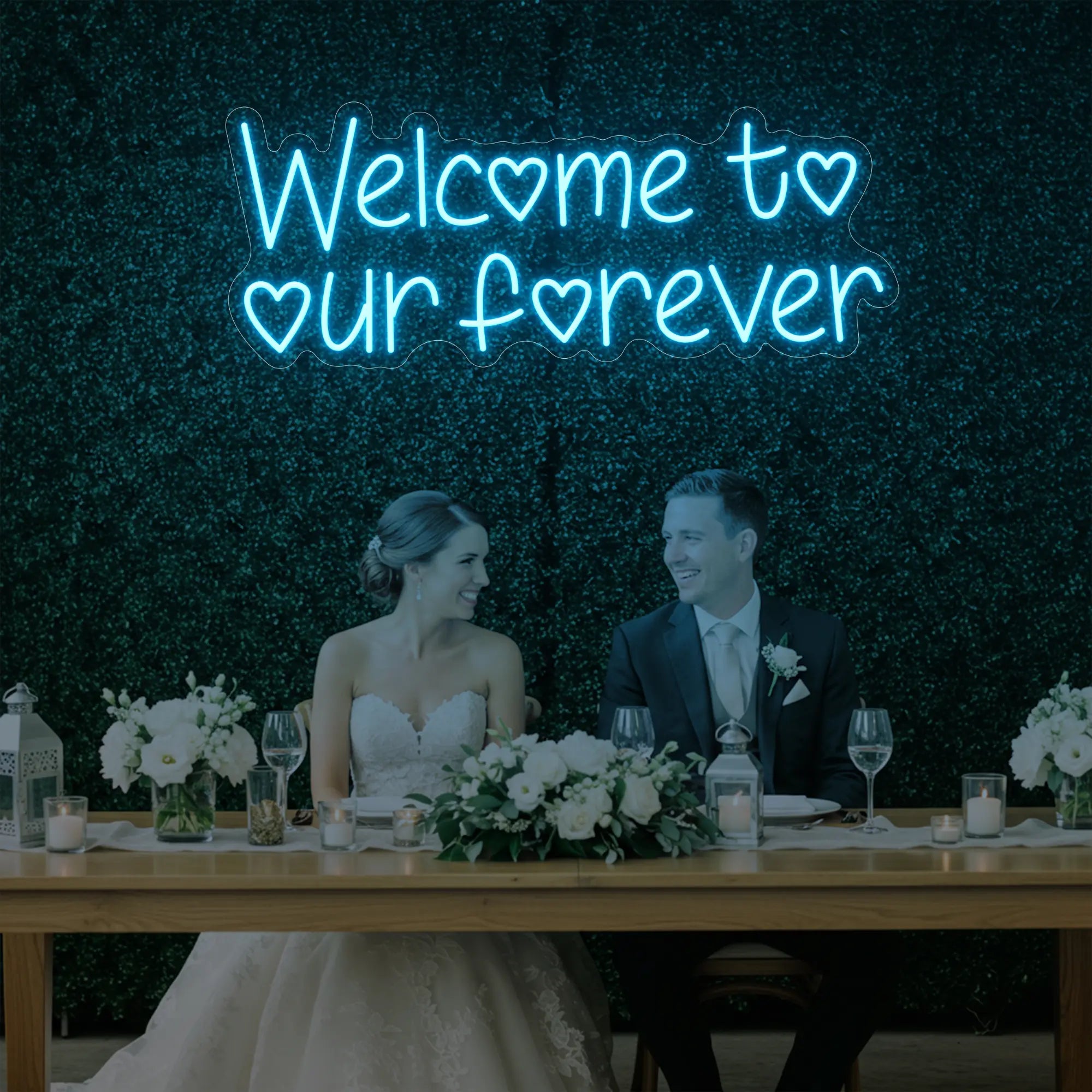  'Welcome To Our Forever' neon sign glowing in ice blue against a styled interior wall.