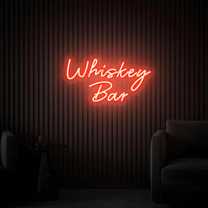 Photo of the 'Whiskey Bar' neon sign glowing in red against a vintage whiskey bar-inspired wall.