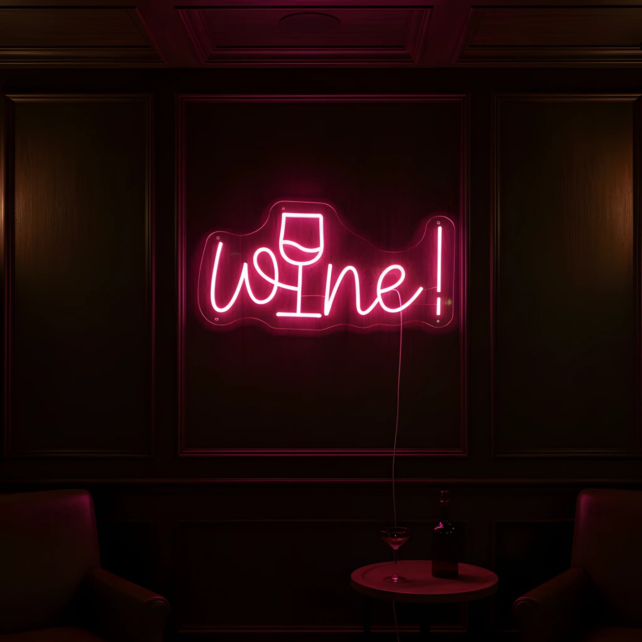 Photo of the 'Wine!' neon sign glowing in pink against a stylish wine bar-inspired wall.