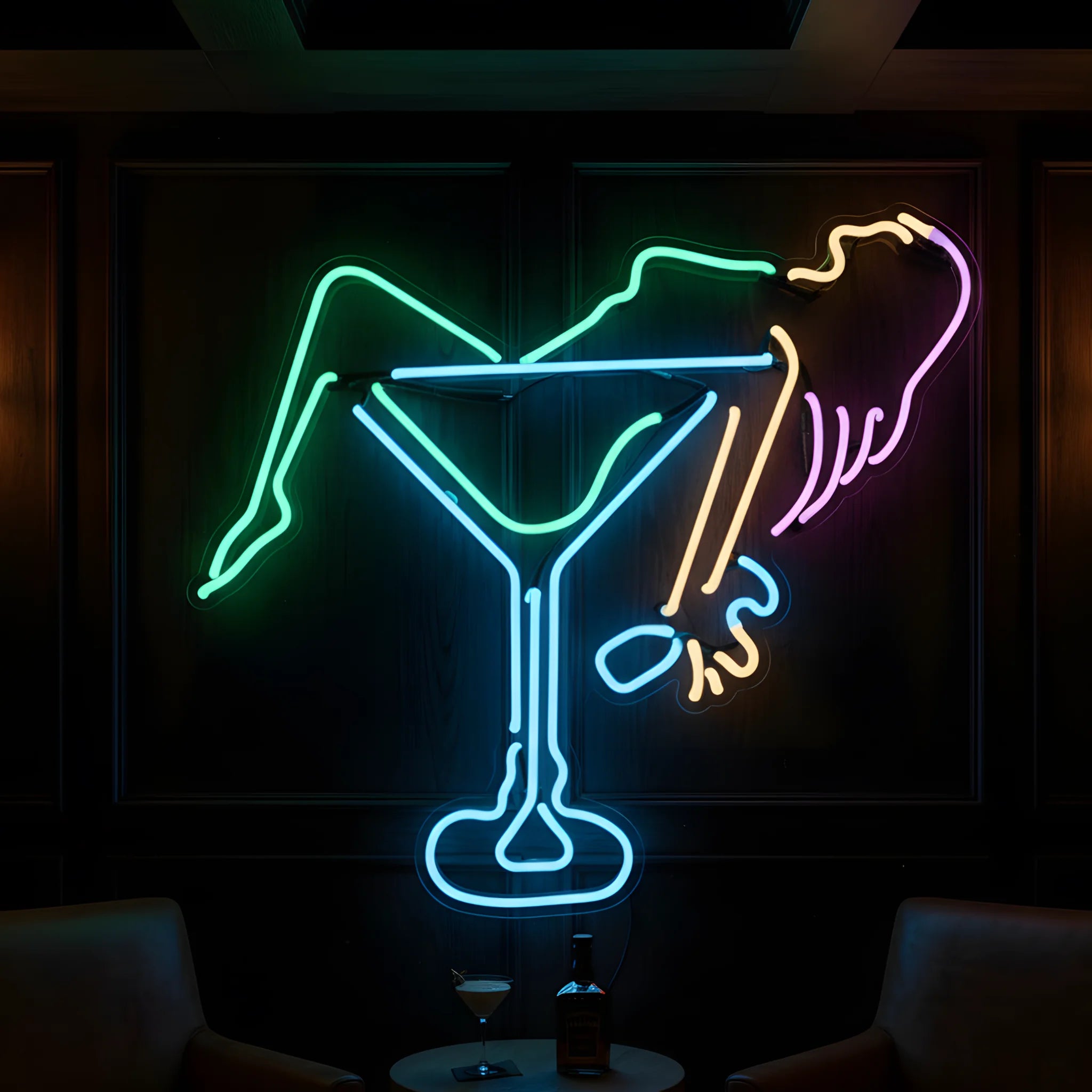 Photo of the 'Woman in Martini' neon sign glowing in multi-color against a chic cocktail lounge-inspired wall.