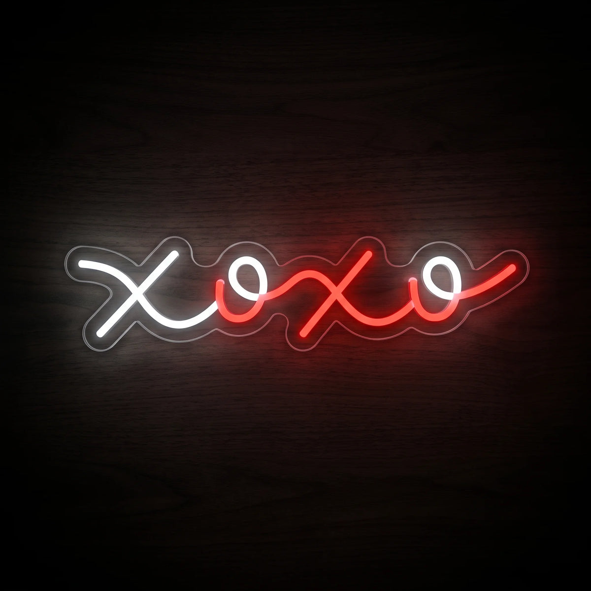 XOXO Script LED Neon Sign featuring flowing white and red XOXO lettering on a clear acrylic backing.