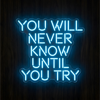 “You Will Never Know Until You Try” LED Neon Sign with bright blue lettering and small smile-like curves in the letters, mounted on clear acrylic against a dark wood background, ideal for a home office or gym.